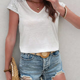 MARIANA | V-kivágású, rövidujjú, csillogó póló